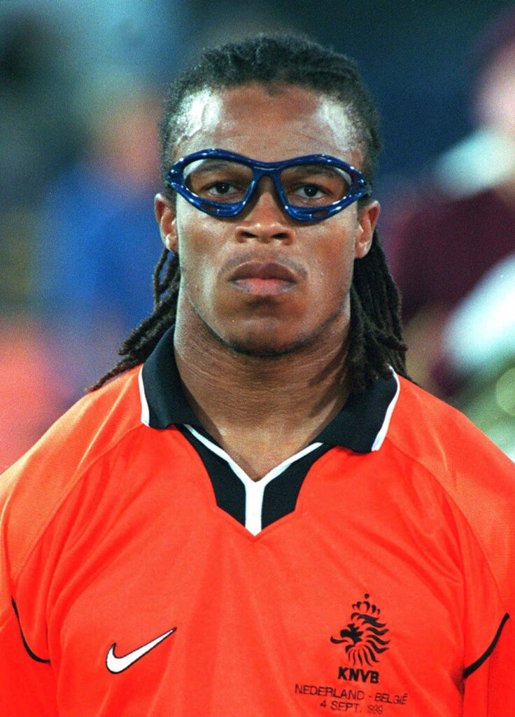 Edgar Davids in orange Netherlands jersey and sports goggles with intense focused expression Wallpaper
