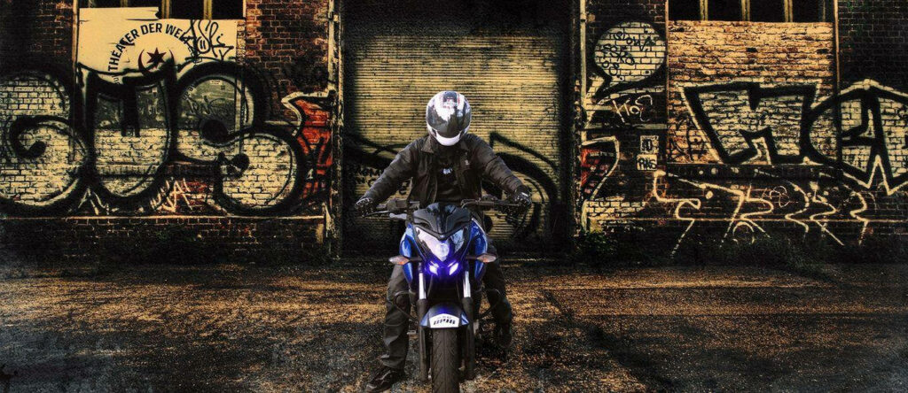 Edgy NS 200 Motorcycle Wallpaper Against Graffiti Wall Background