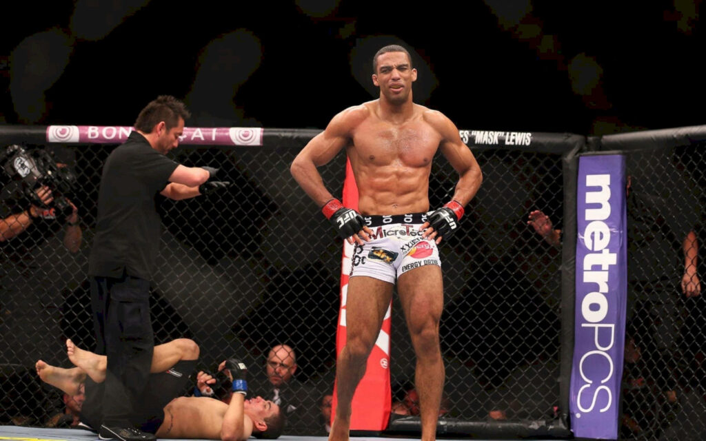 Edson Barboza in octagon showing athletic physique and intense focus during MMA fight wallpaper