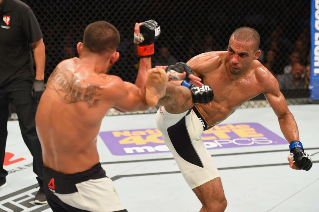 Edson Barboza kicks Anthony Pettis UFC fight intense action dynamic movement sharp lighting Wallpaper