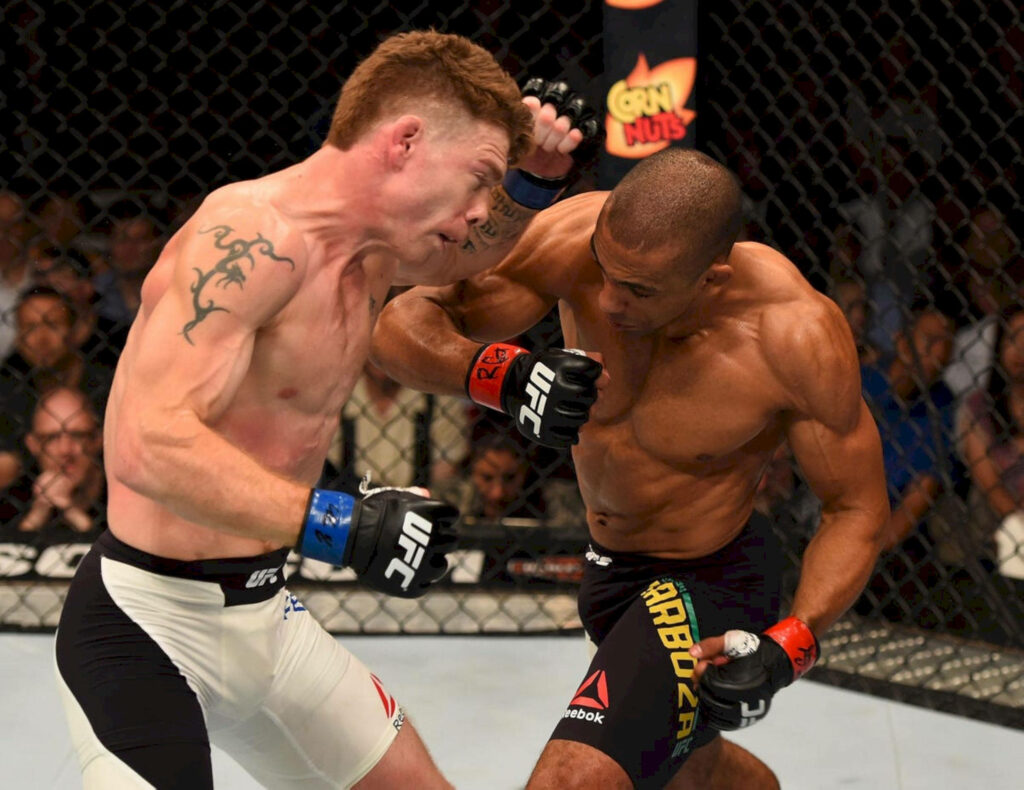 Edson Barboza and Paul Felder UFC fight intense moment powerful physiques in octagon cage Wallpaper