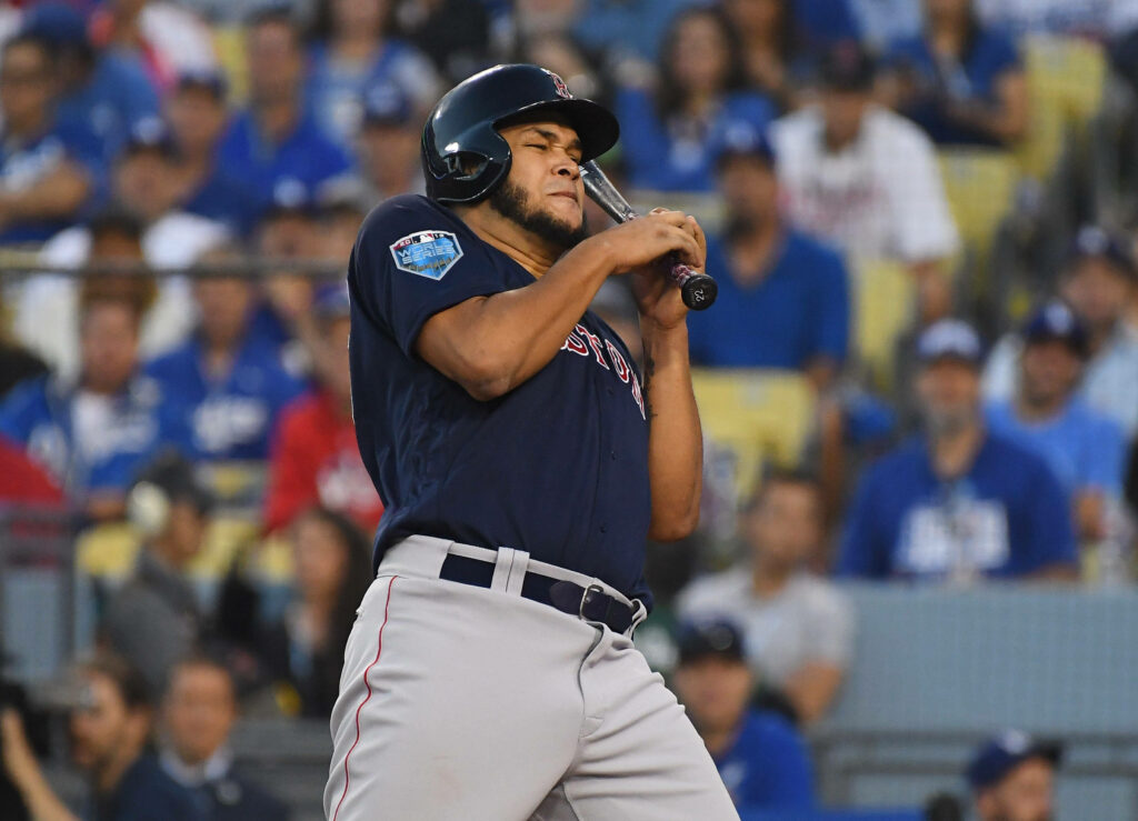 Eduardo Rodríguez pitching for Boston Red Sox with intense focus and cheering crowd background Wallpaper