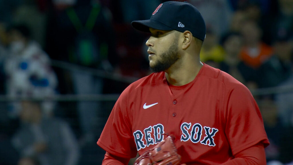 Eduardo Rodríguez pitching in red Boston Red Sox jersey with intense focus on mound Wallpaper