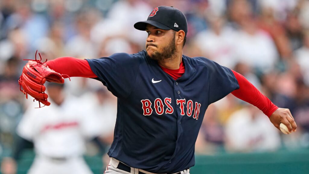 Eduardo Rodríguez pitching in Boston Red Sox navy and red uniform intense baseball action shot Wallpaper