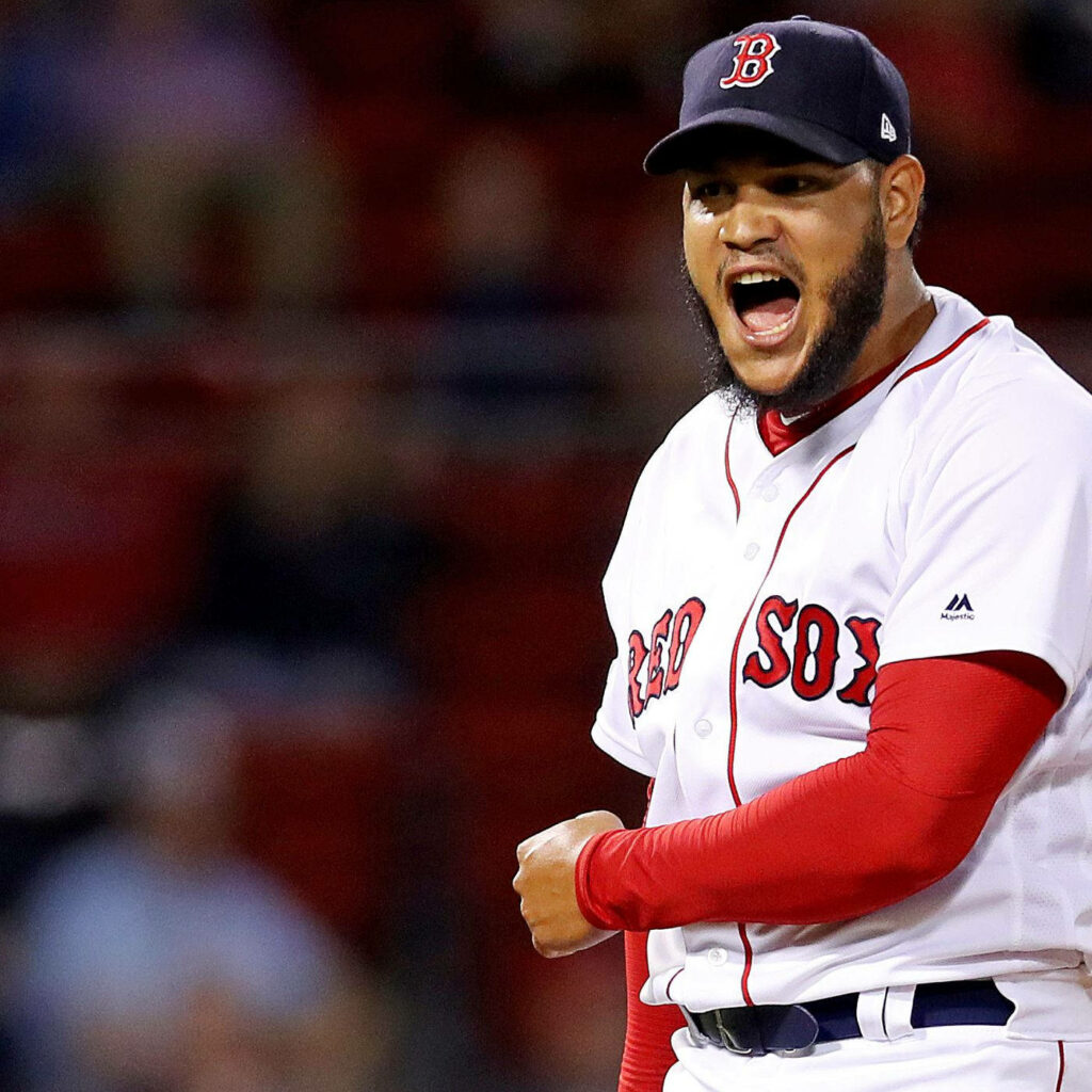 Eduardo Rodríguez Boston Red Sox pitcher celebrating intensely in red white uniform on field Wallpaper