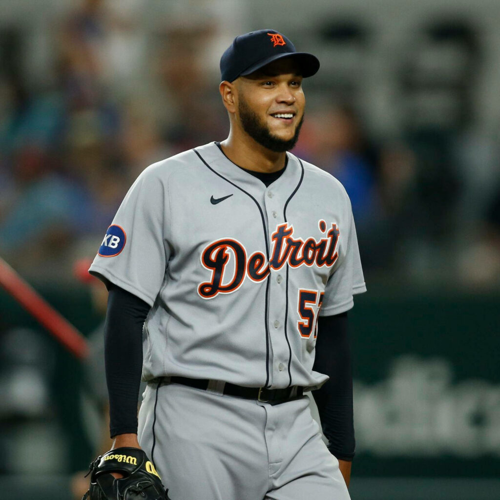 Eduardo Rodriguez in Detroit Tigers uniform smiling during live baseball game on field action Wallpaper
