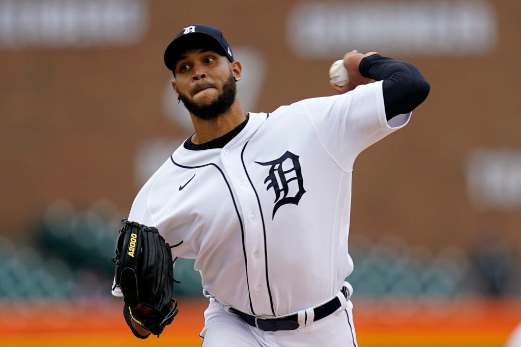 Eduardo Rodríguez Detroit Tigers pitcher mid-pitch in white uniform with blurred stadium background Wallpaper