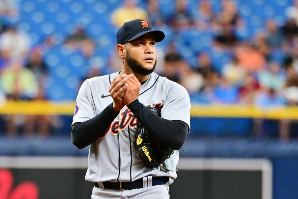 Eduardo Rodríguez pitching in Detroit Tigers uniform with vibrant stadium and crowd background Wallpaper