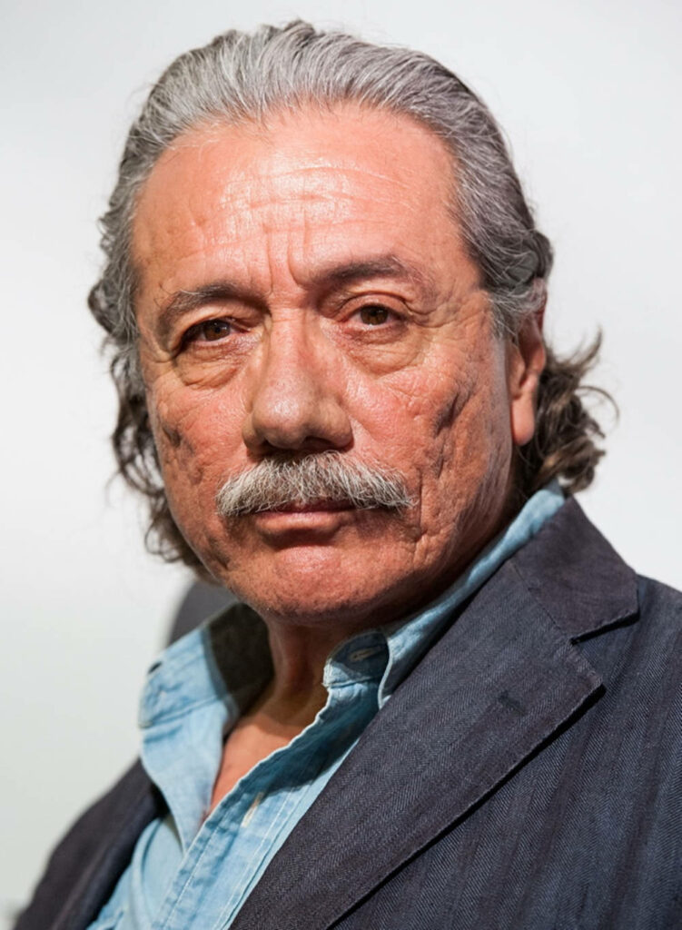 Edward James Olmos close-up portrait with mustache soft lighting gray hair blue shirt suit jacket Wallpaper