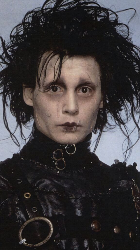 Edward Scissorhands portrait with pale skin wild hair and leather outfit wallpaper background