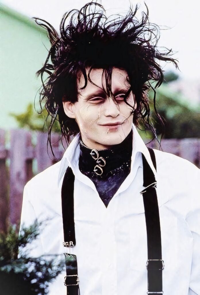 Edward Scissorhands outdoors with wild hair white shirt black suspenders dark accessories wallpaper