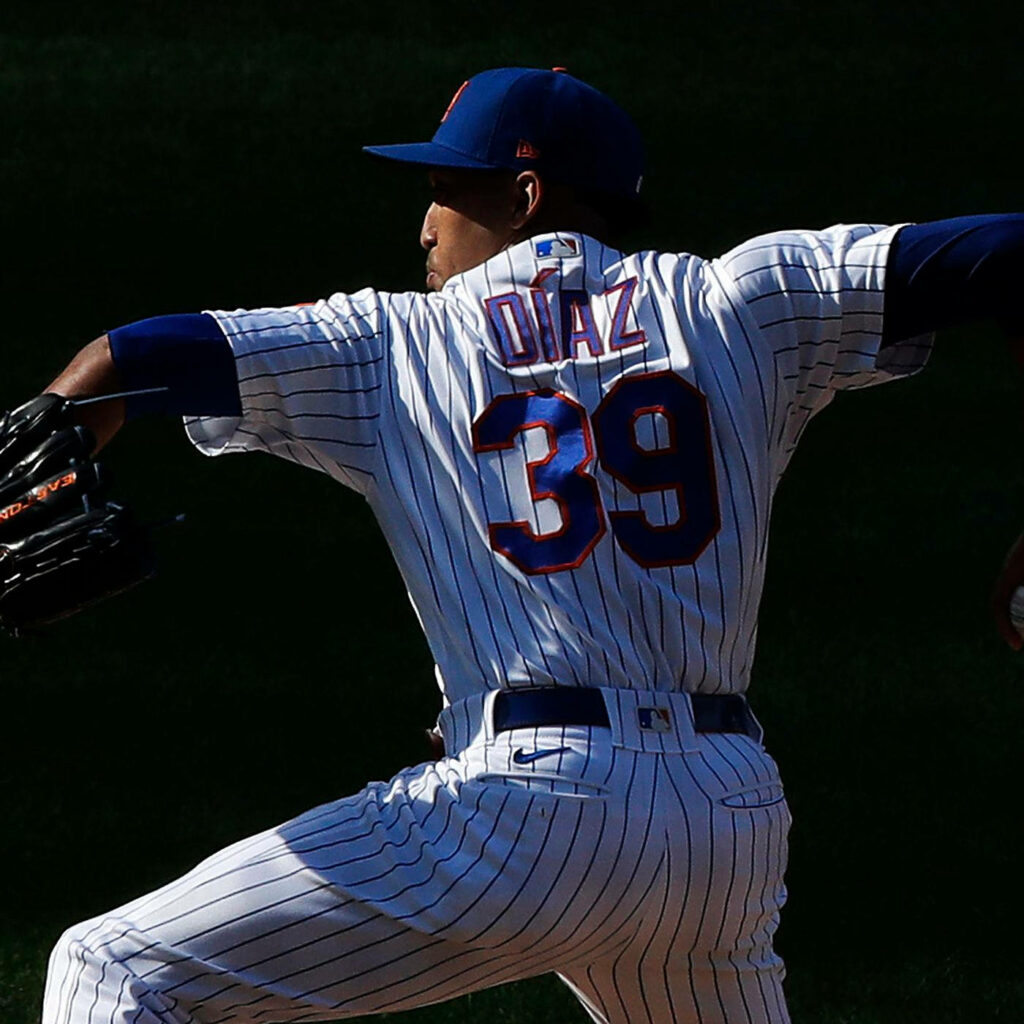 Edwin Diaz pitching in Mets white blue pinstriped uniform dynamic wallpaper action intense