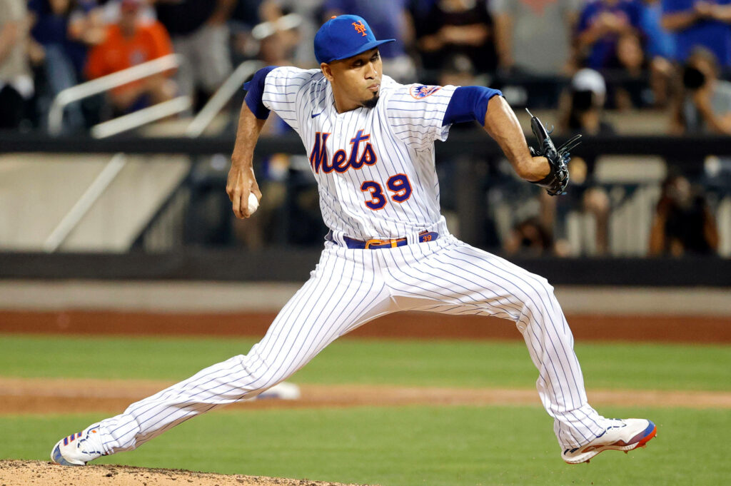 Edwin Diaz pitching for New York Mets in blue orange uniform vibrant stadium backdrop wallpaper