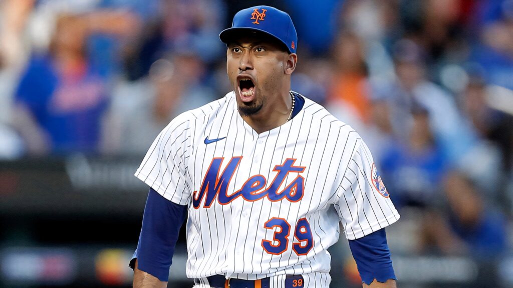 Edwin Diaz pitching for New York Mets in blue orange jersey dynamic high-resolution action shot Wallpaper
