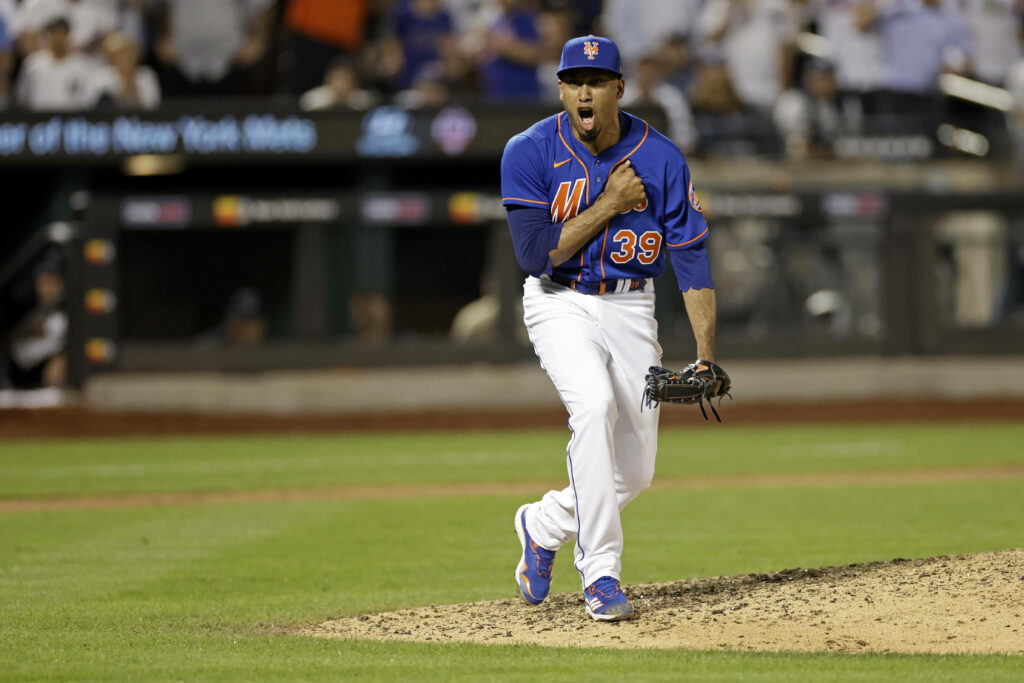 Edwin Diaz celebrating on New York Mets mound under stadium lights intense baseball moment wallpaper
