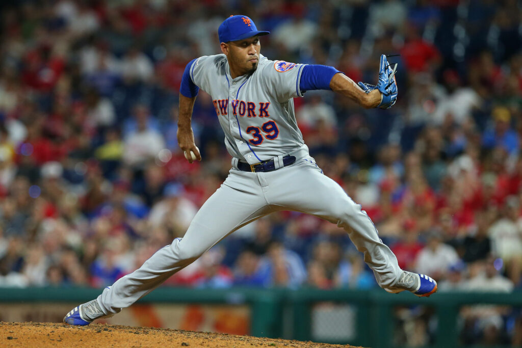 Edwin Diaz New York Mets pitching mid-throw in gray blue uniform number 39 stadium background Wallpaper