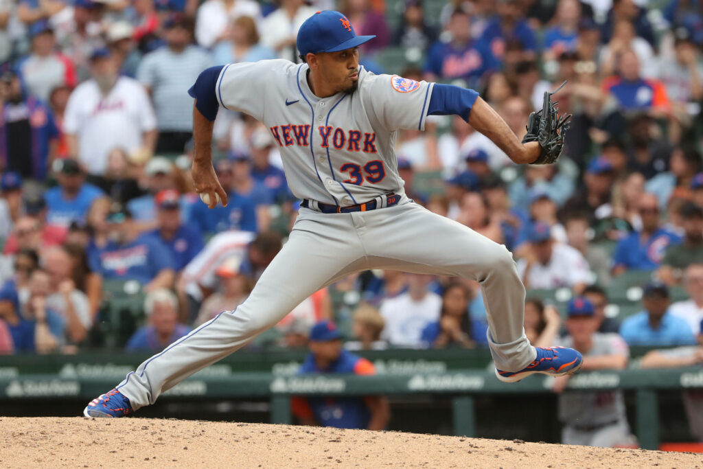 Edwin Diaz pitching for New York Mets in blue and grey uniform stadium background wallpaper