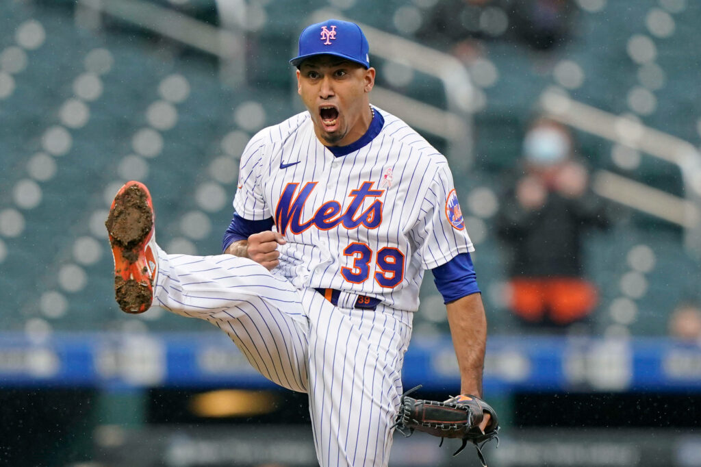 Edwin Diaz Mets closer celebrating in pinstriped uniform with electric blue cap on field Wallpaper
