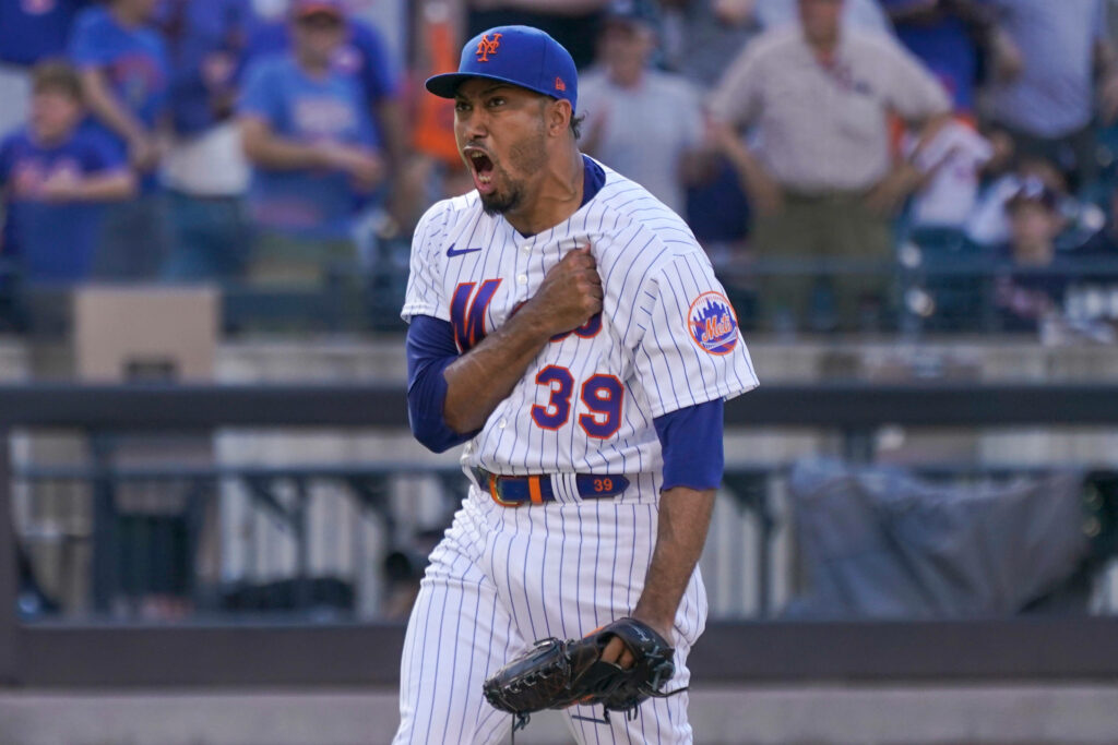Edwin Diaz celebrating on mound in Mets pinstripe uniform vibrant baseball action wallpaper