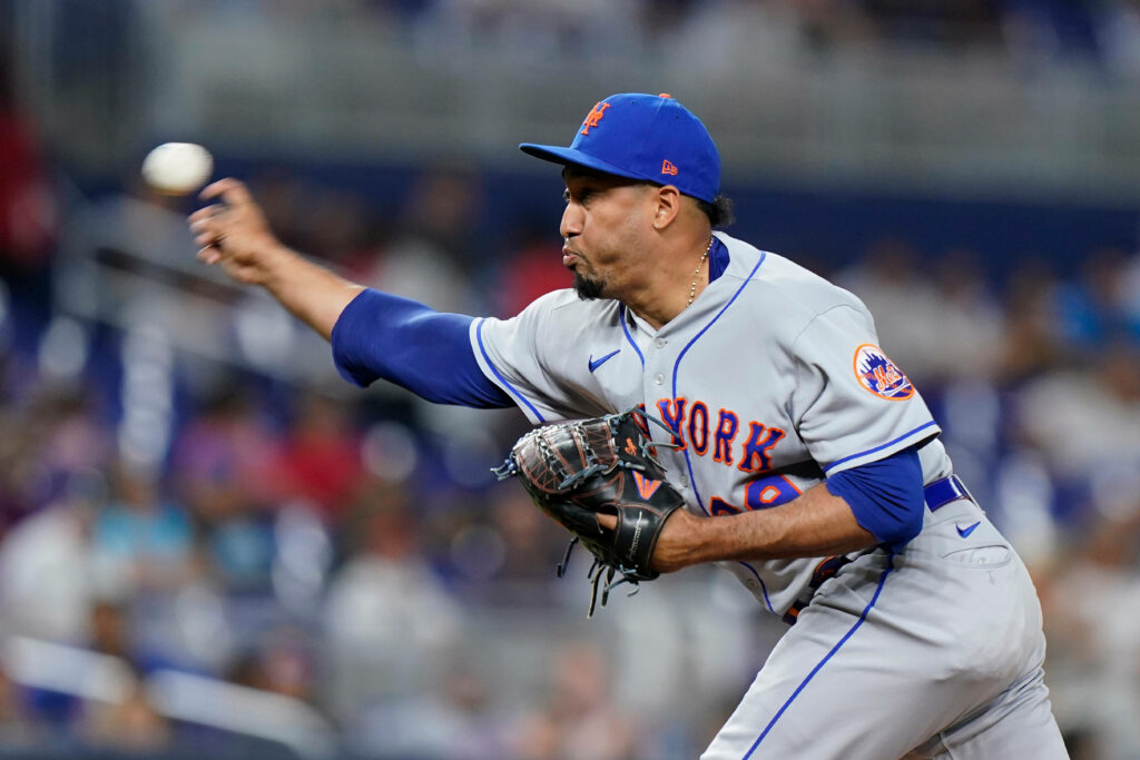 Edwin Diaz pitching for New York Mets in vibrant blue orange uniform high definition wallpaper