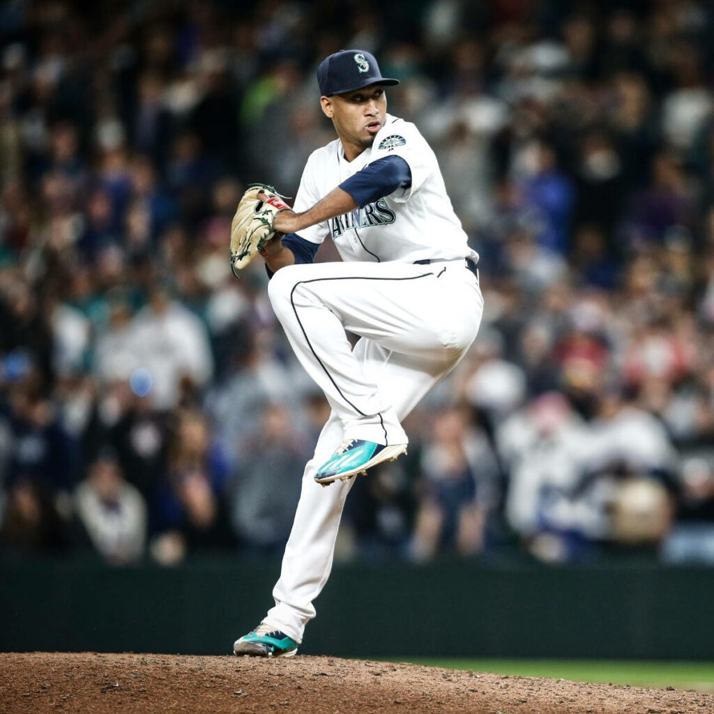 Edwin Diaz pitching in Seattle Mariners uniform with blurred crowd intense baseball action wallpaper