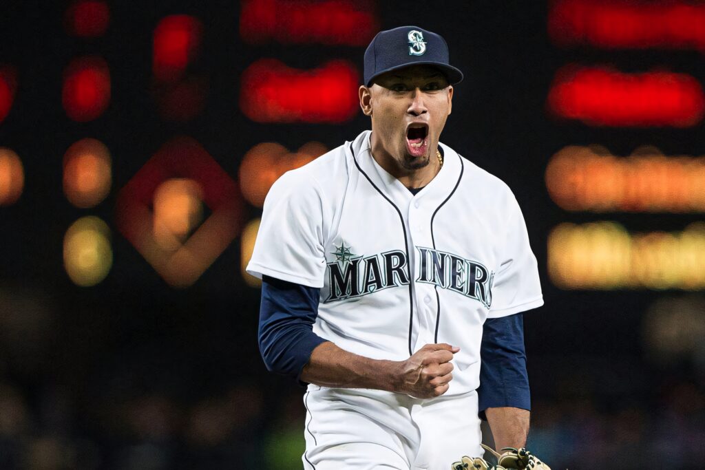 Edwin Diaz Seattle Mariners pitcher celebrating crucial moment vibrant stadium lights wallpaper