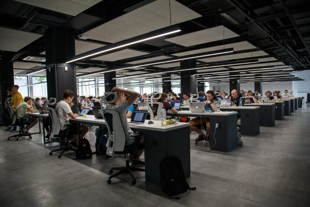 Busy Bees in the Corporate Hive: Vibrant 5K Wallpaper with Professionals Engaged in Office Activities