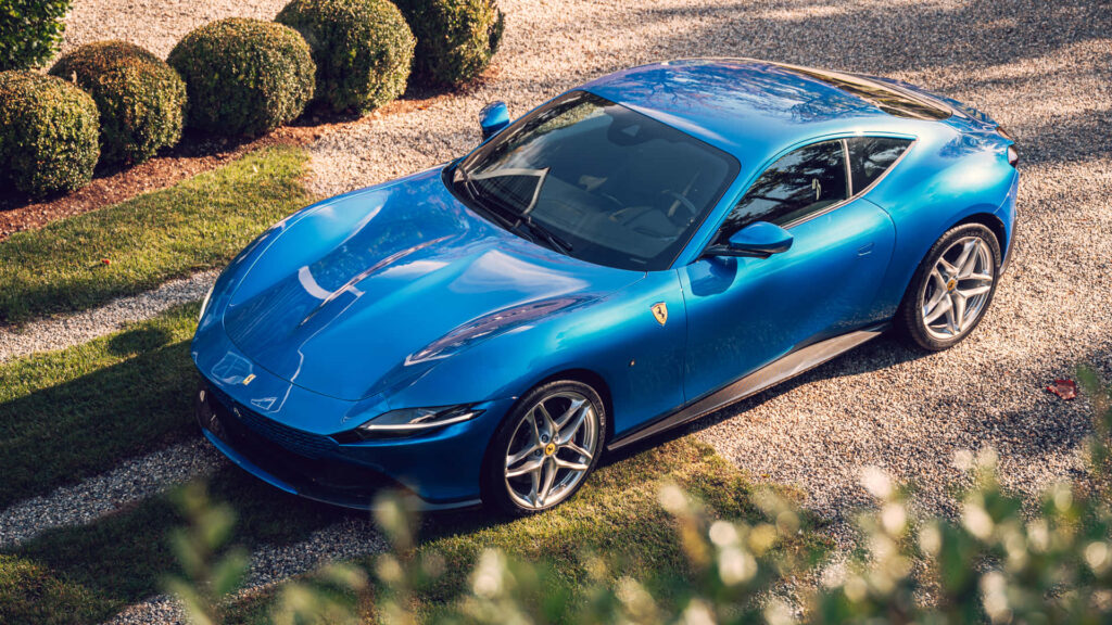 Blue Ferrari Roma on a Road Background Wallpaper