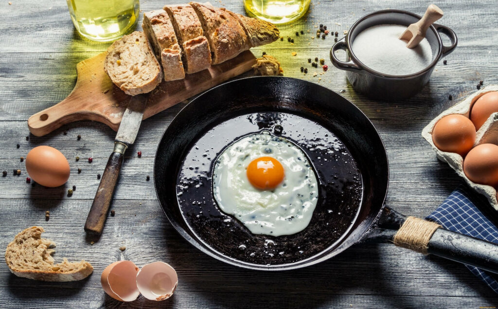 Egg-citing Culinary Adventure: A Whimsical Wallpaper Unveiling Delicious Cooking Ingredients and Sizzle of a Fried Egg