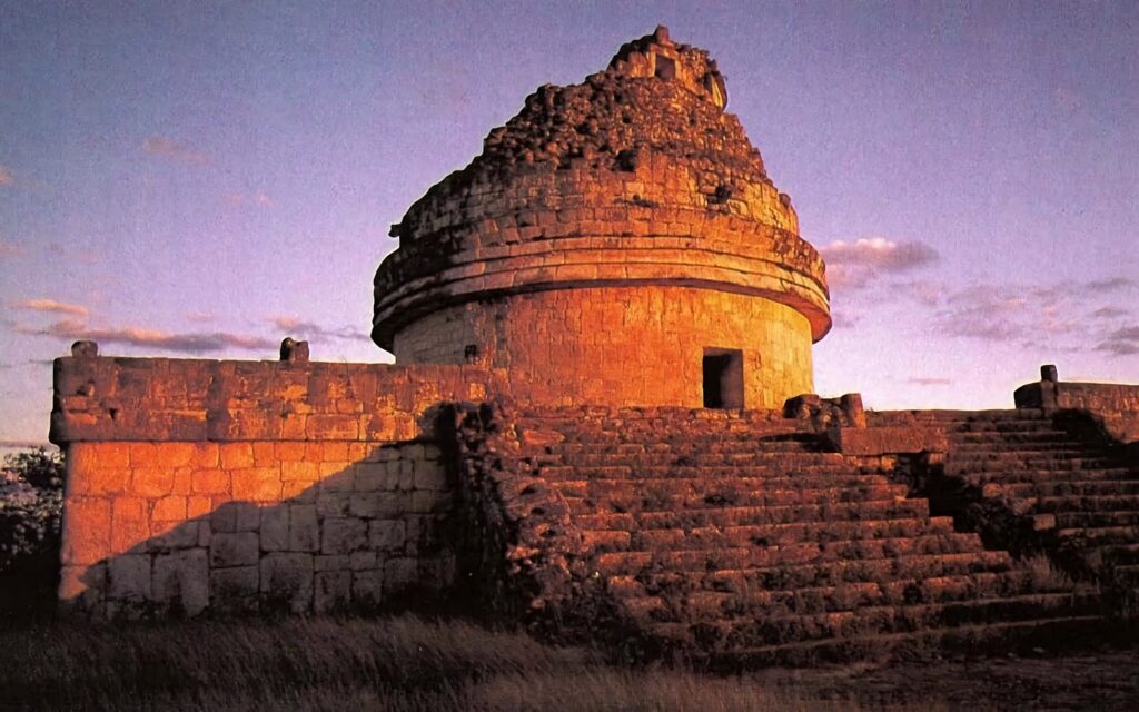 El Caracol at Chichen Itza: Vibrant Sunset Wallpaper Background