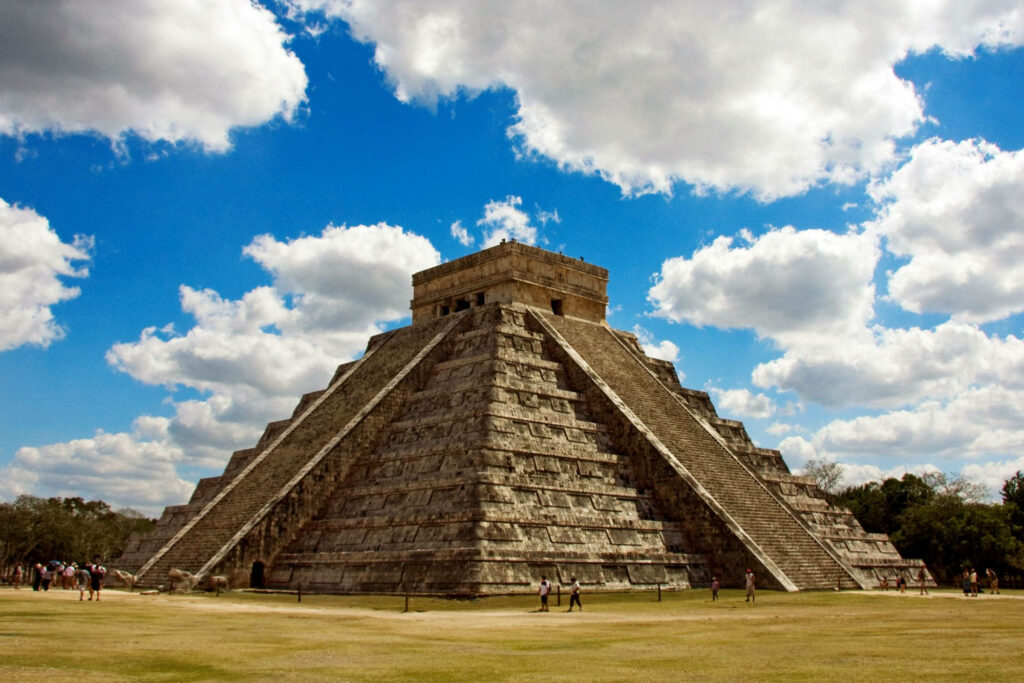 El Castillo Pyramid Wallpaper: Majestic Chichen Itza Under Blue Sky