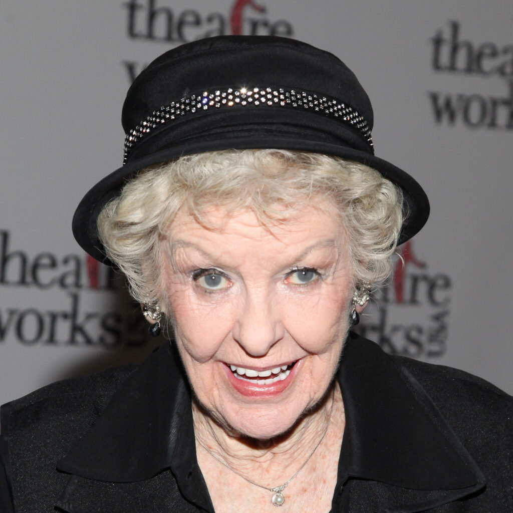 Close-up portrait of actress Elaine Stritch smiling wearing rhinestone black hat theatrical elegance Wallpaper