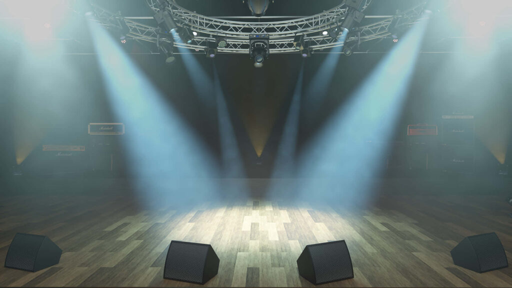 Electrifying Ambiance: A Stage with Majestic Metal Truss and Striking Lighting Wallpaper