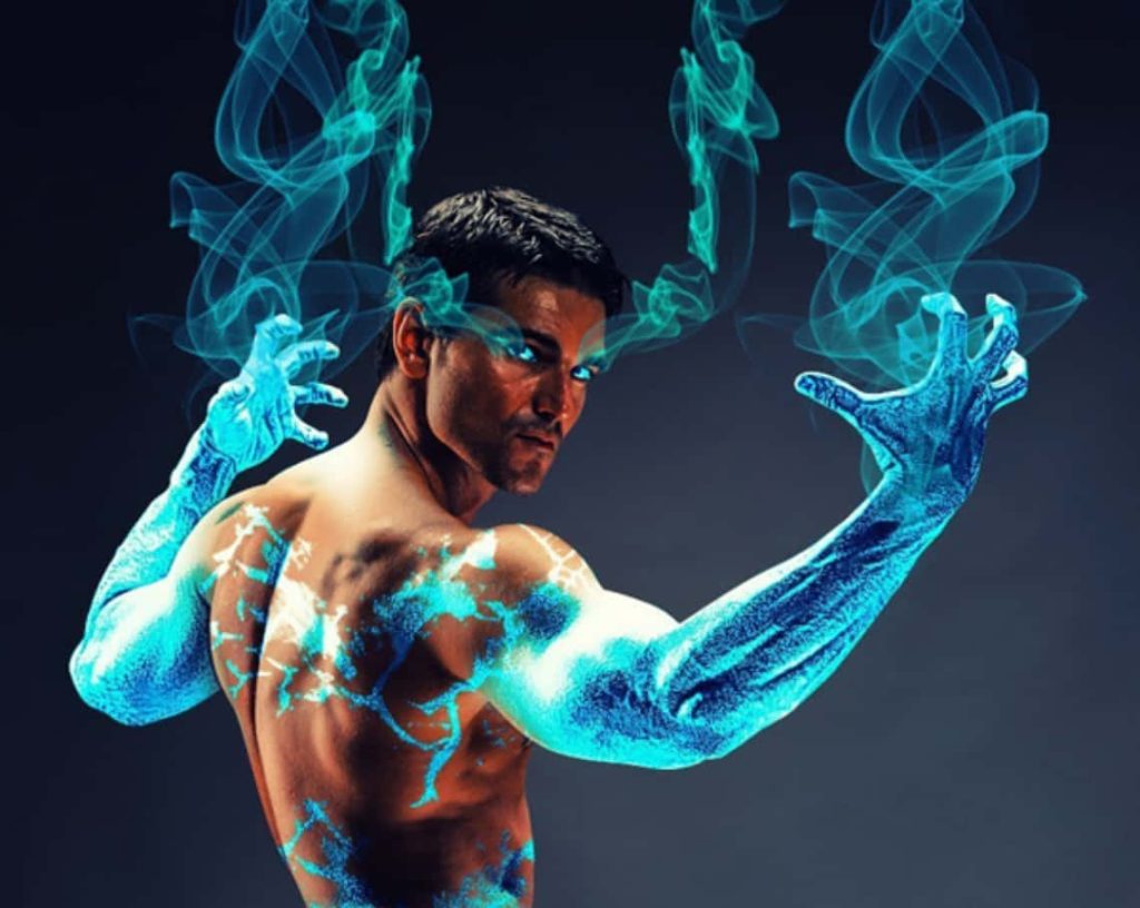 Muscular shirtless man with glowing eyes and blue lightning effects in digital art fantasy portrait Wallpaper