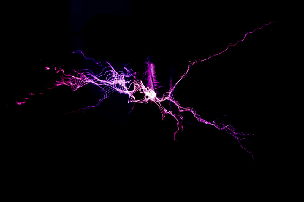 Vibrant Purple Electric Lightning Illuminating an Enigmatic Dark Backdrop in a Captivating Photo Wallpaper