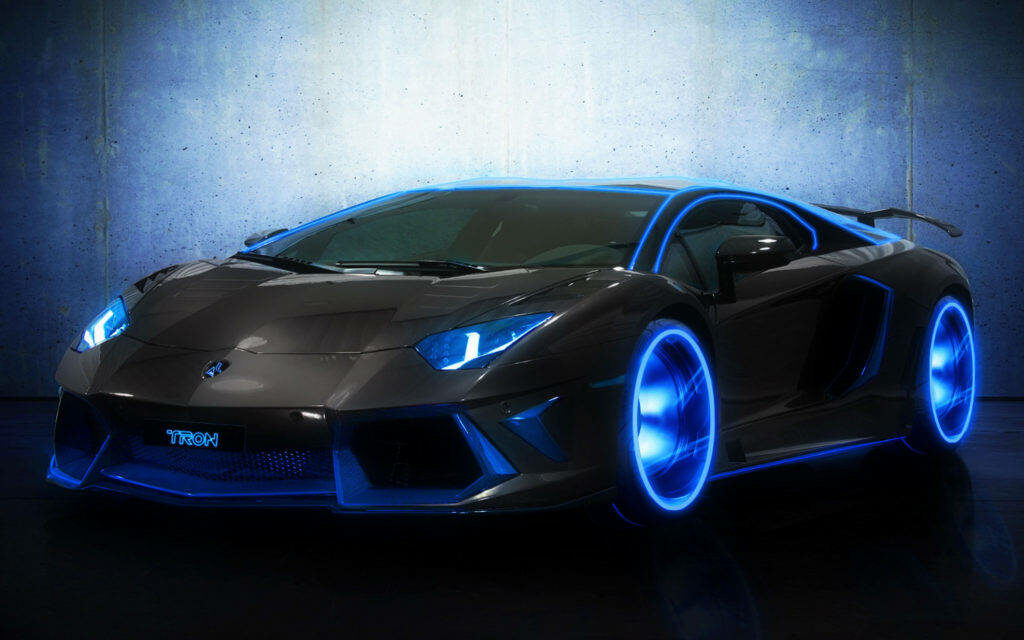 Electric Elegance: A Black and Blue Lamborghini Exudes Style Against a Sleek Background Wallpaper