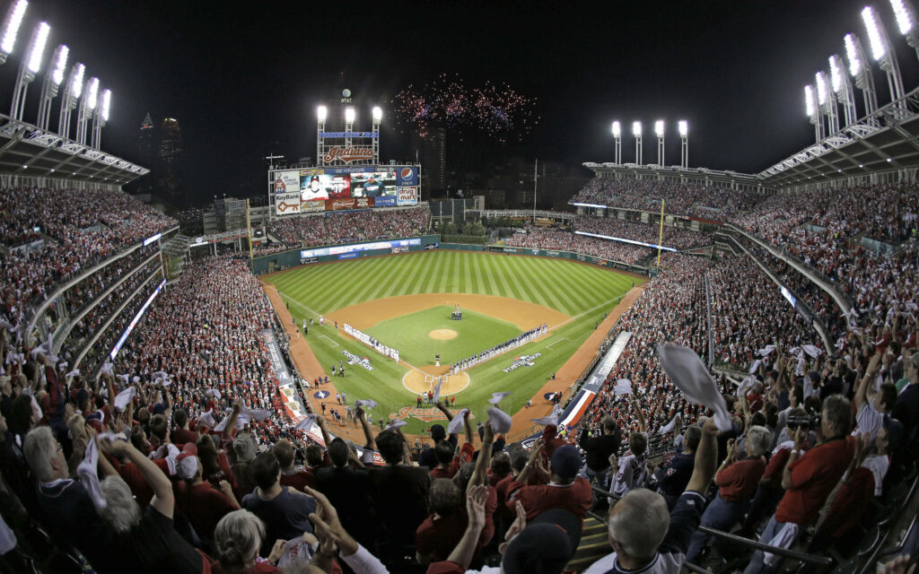 Night game at Progressive Field with fireworks and packed fans in Cleveland Indians colors Wallpaper