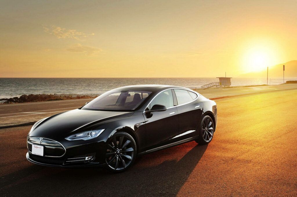 Electric Elegance: Sunrise Ride in the Tesla Model S Sedan Wallpaper