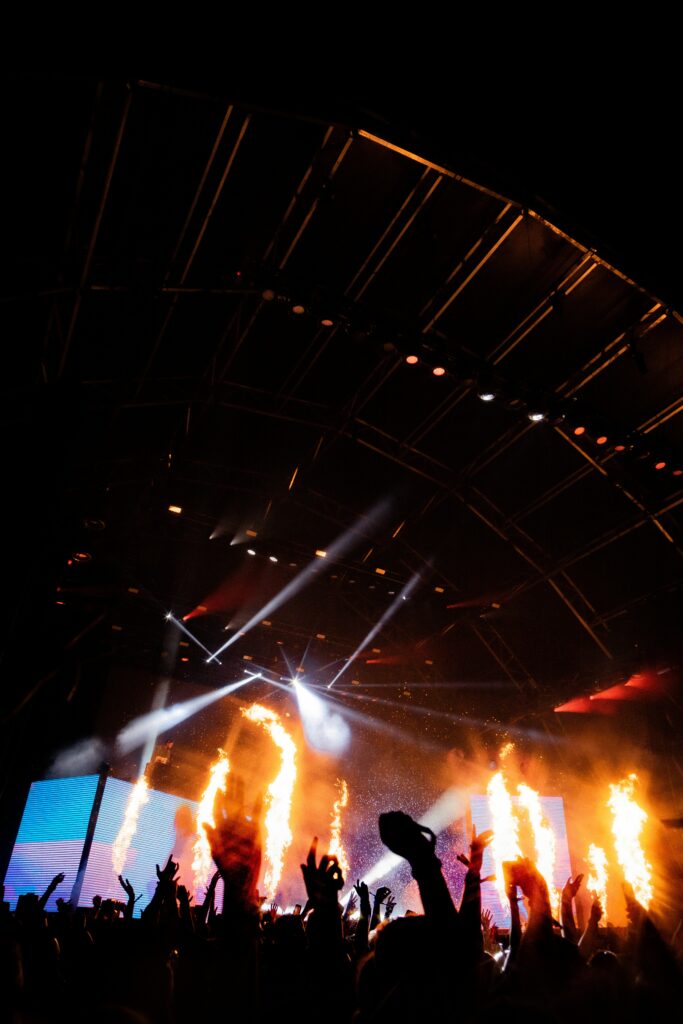 Electrifying Concert Wallpaper: Lively Stage & Fire Effects