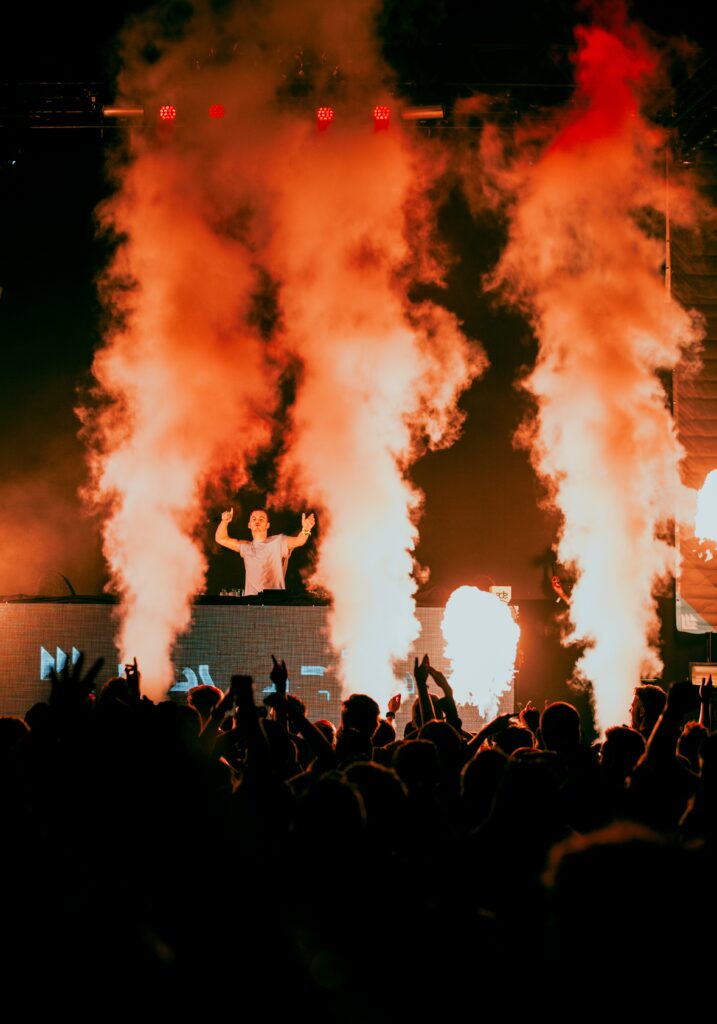 Vibrant DJ Concert Wallpaper: Electric Energy & Dazzling Lights