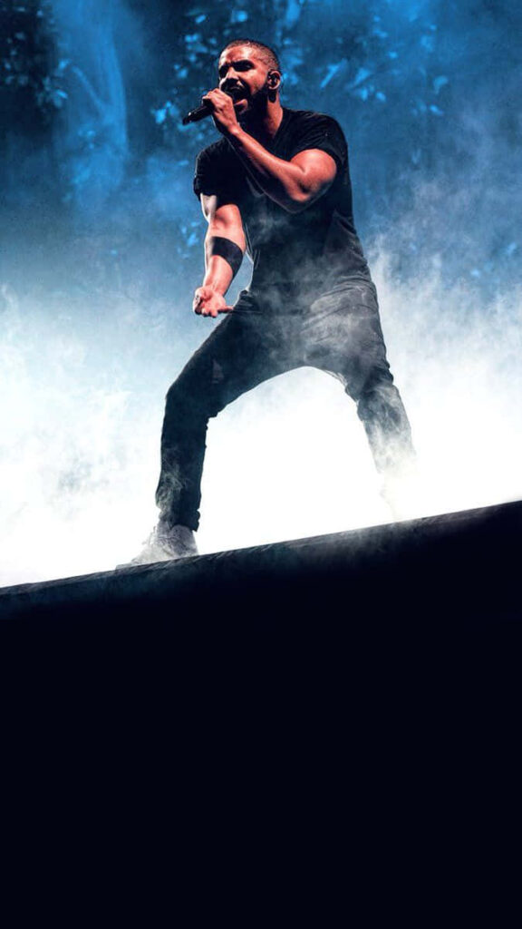 Vibrant Drake Performance Wallpaper: Electrifying Stage Atmosphere