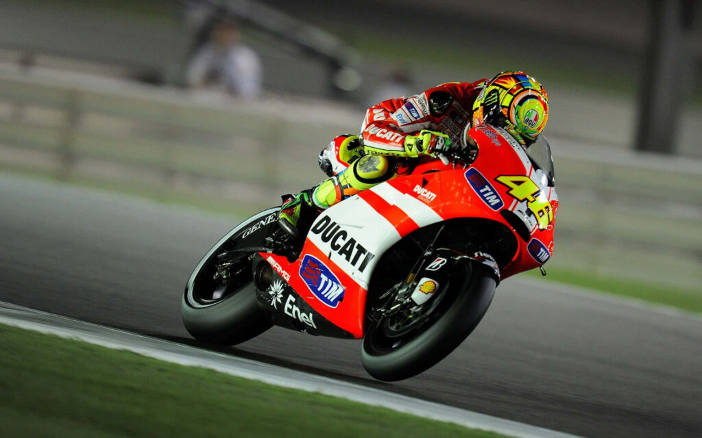 Electrifying VR46 Qatar MotoGP Wallpaper: Ducati Speed in Action