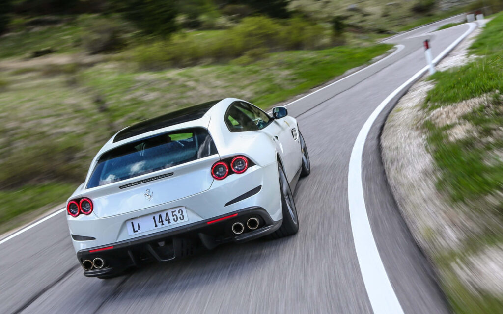 Ferrari GTC4Lusso: Unleashing Elegance and Power on Scenic Roads Wallpaper