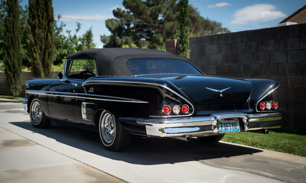 Sleek 1958 Chevrolet Impala Wallpaper: Retro Elegance in Black