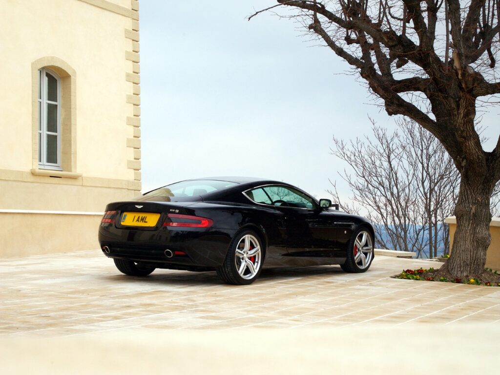 Stunning 2006 Aston Martin DB9 Side View Wallpaper in Elegant Setting