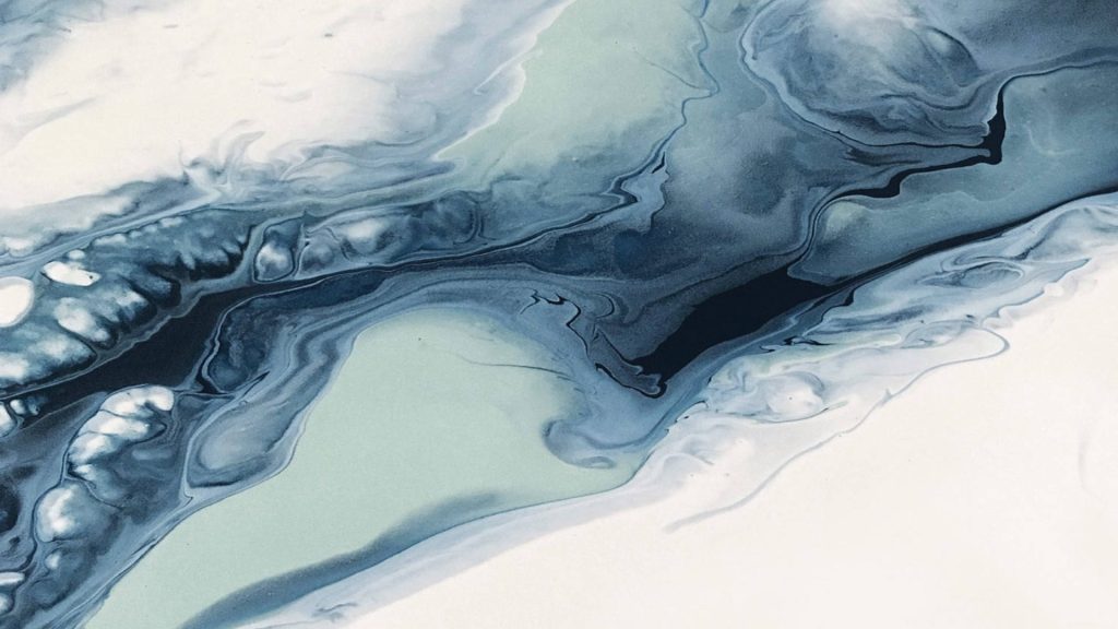 Abstract fluid art wallpaper with navy slate blue and mint green swirling marble design