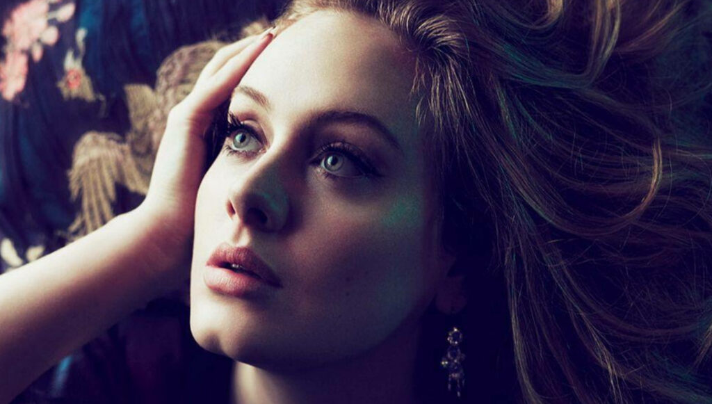 Elegant Adele Wallpaper: Captivating Expression with Soft Background