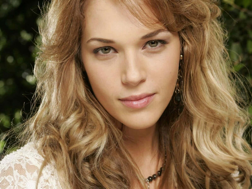 Amanda Righetti elegant portrait with soft curls and serene natural background wallpaper