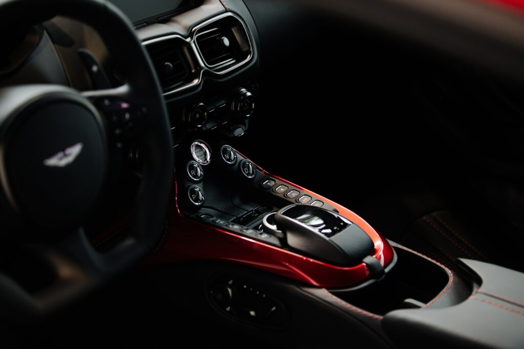 Luxurious Aston Martin Interior Wallpaper: Elegant Control Panel Design