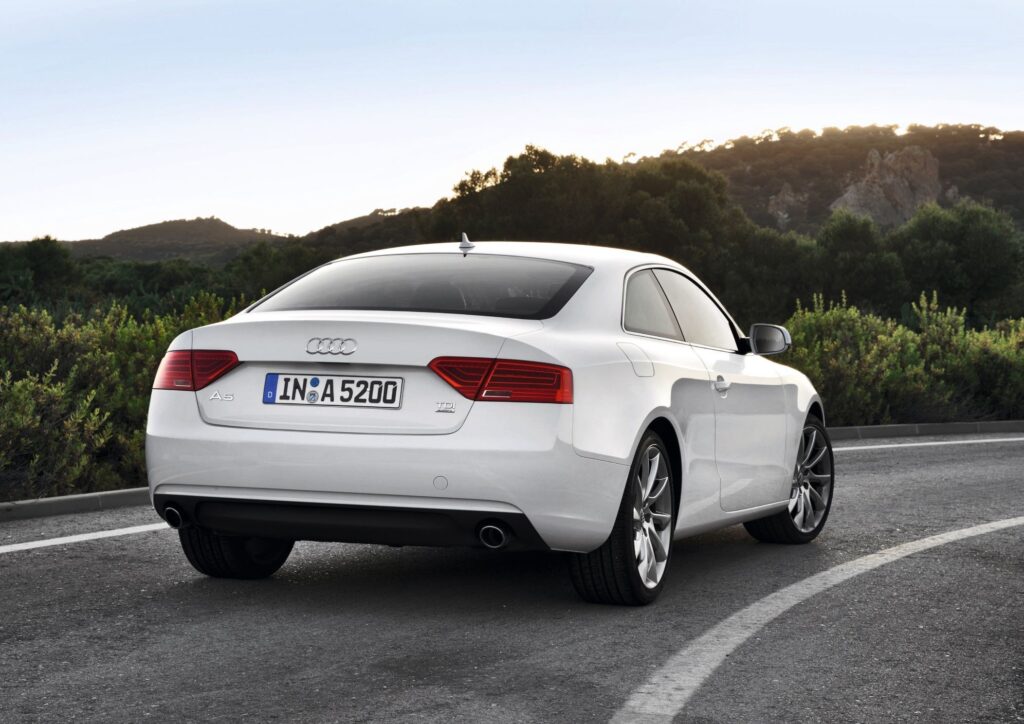 Sleek Audi A5 TDI Rear View Wallpaper in Scenic Landscape